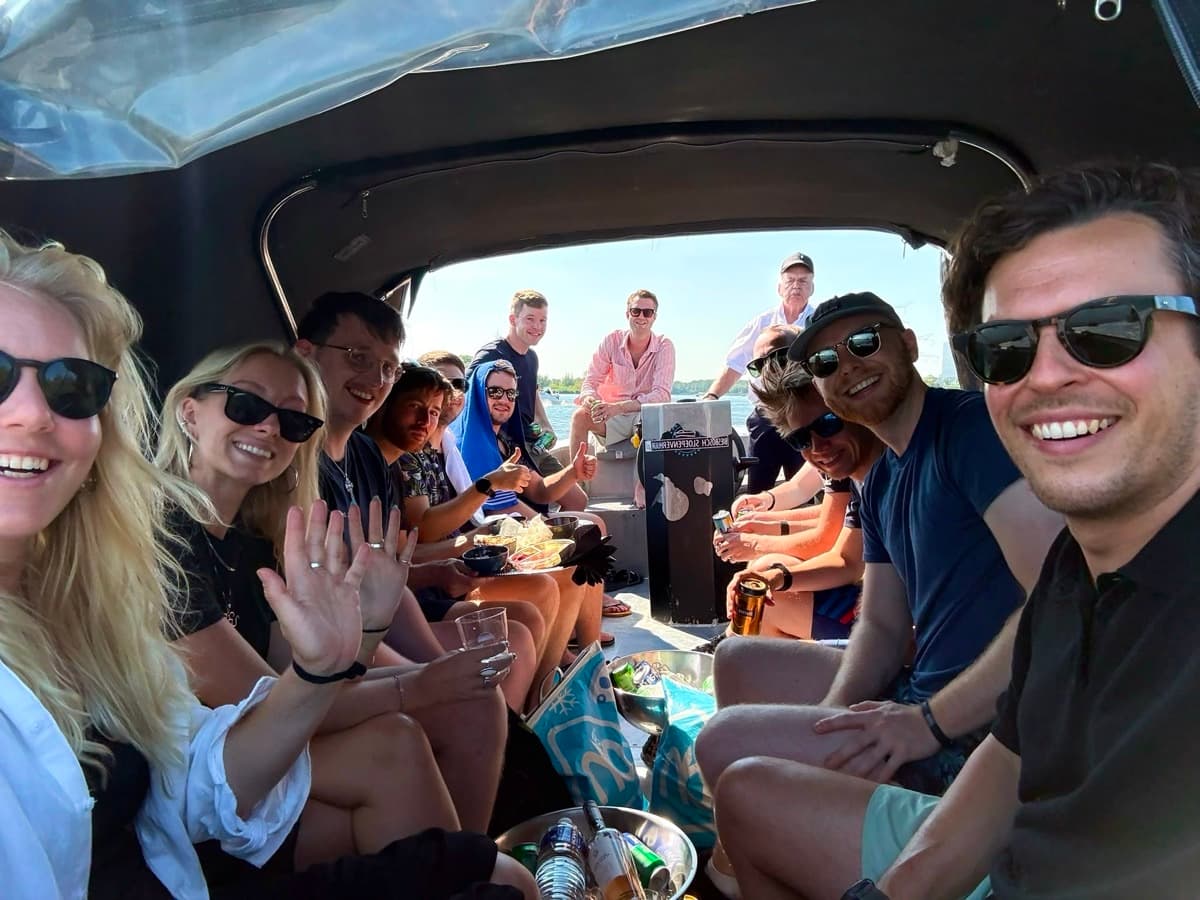 Tripleblue team on a boat outing with food and drinks