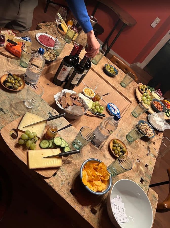 Team gathering around food and drinks