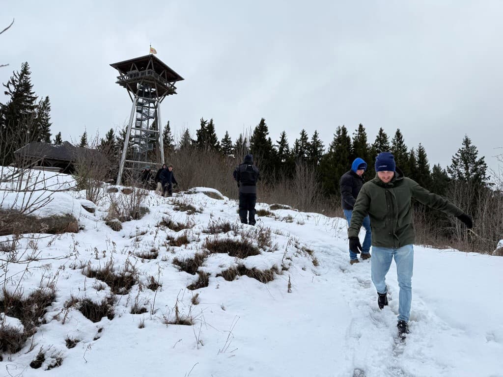 Team at the observation tower in the snow
